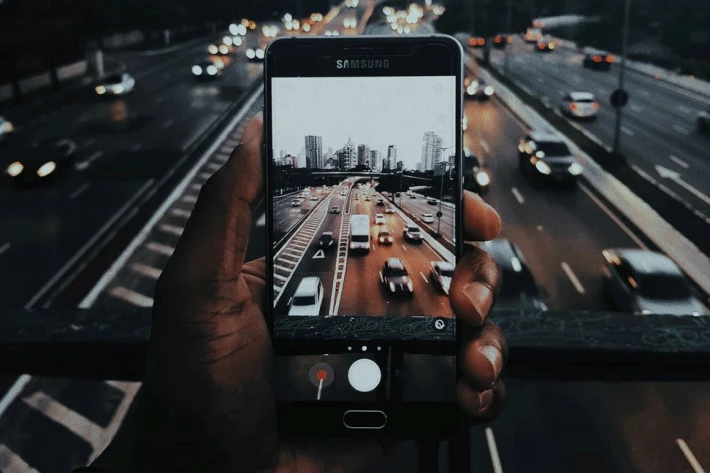 Person Taking a Picture With Their Phone