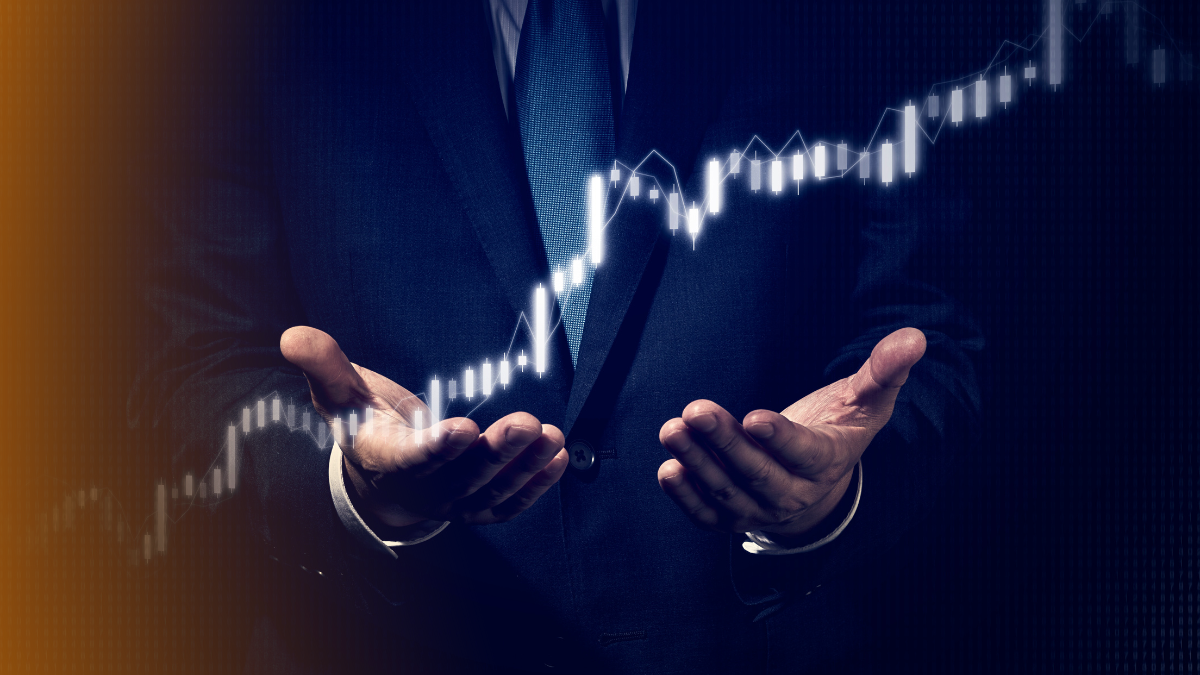 Businessman in a suit holding a glowing rising stock chart, symbolizing financial growth, investment success, and market opportunities.