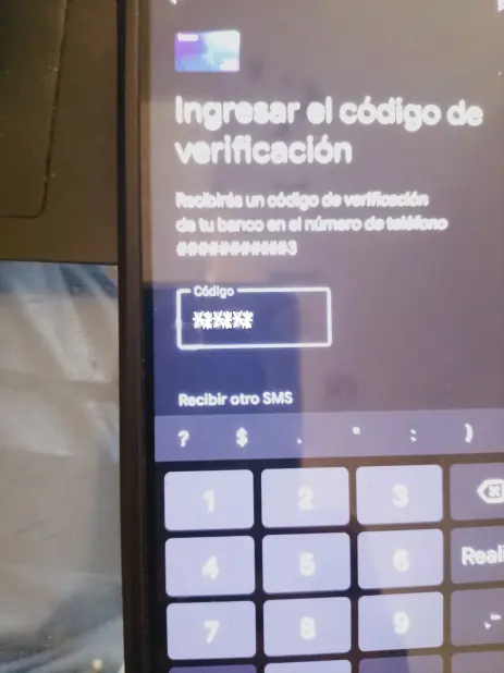 Google Pay screen to enter the SMS or dashboard verification code to activate contactless payments