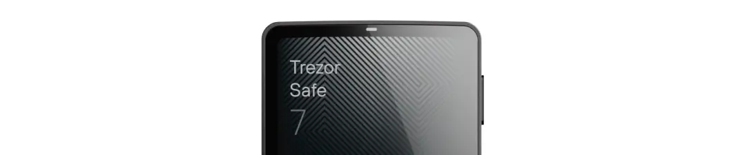 The Trezor Safe 7 features a premium anodized aluminum unibody, with a reinforced glass back. Achieving an IP54 rating for dust and splash resistance. The large high-resolution touchscreen (520x380 px) is protected by scratch and fingerprint-resistant Gorilla Glass. It delivers crisp details, vivid colors and 700 nits of brightness. For displaying clear visibility, even in bright sunlight.