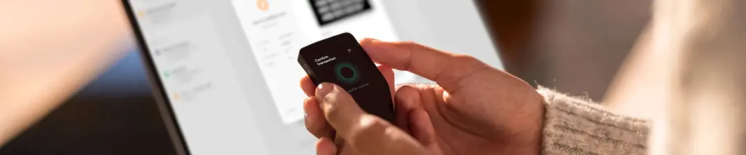 A close-up shot of the Trezor Safe 5 touchscreen wallet in a real world setting. Explore how the Safe 5 stacks up against rivals such as the SecuX V20 and Keystone 3 Pro. Quickly weigh their features to see which device truly leads the pack in today's market.