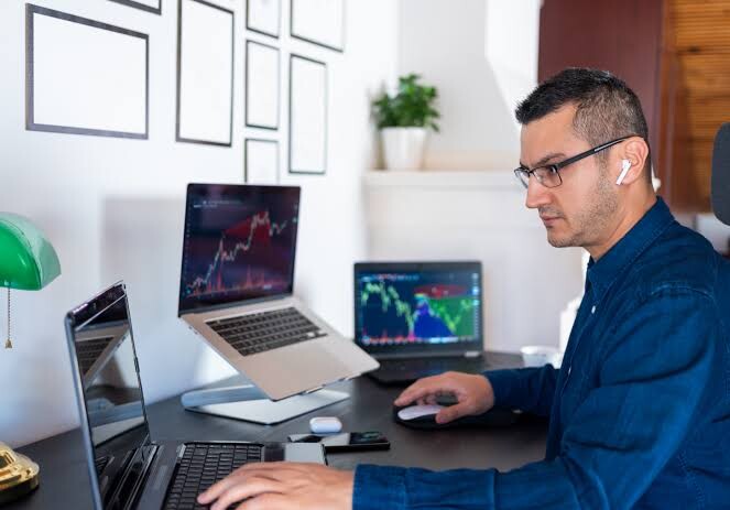 A person analyzing cryptocurrency data on a laptop, symbolizing safe and practical crypto research.”