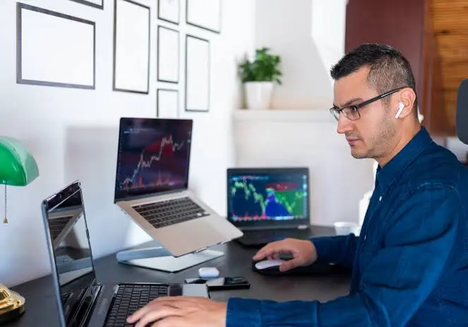 A person analyzing cryptocurrency data on a laptop, symbolizing safe and practical crypto research.”