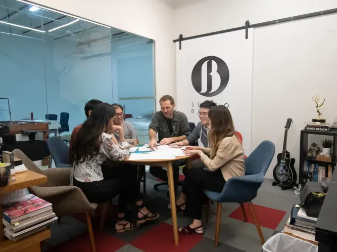 Studio Bound, Singapore. The integrated team: designers, concept artists, technical drafters, and production managers under one roof. Founded by Patrick Larsen, Emmy Award-winning production designer.