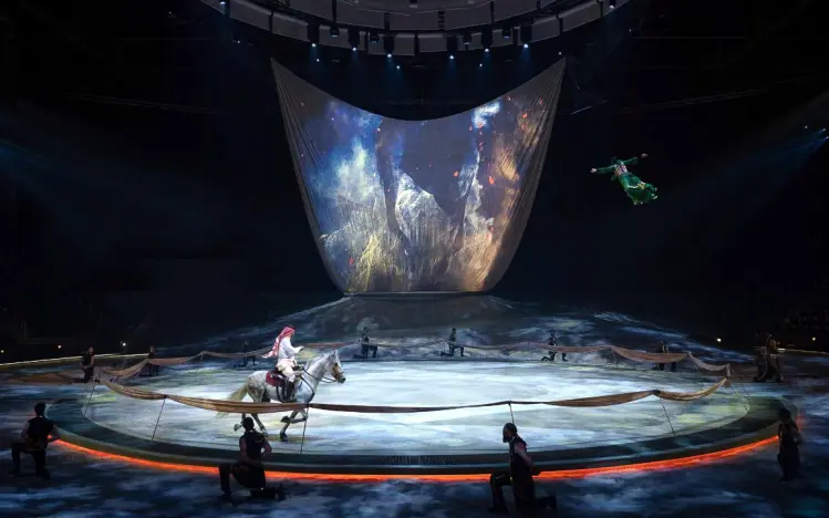 Terhal, Riyadh Season 2025. Production design: Patrick Larsen / Studio Bound, Dragone. The designed environment as the world the performers inhabit — not a set, but a place.