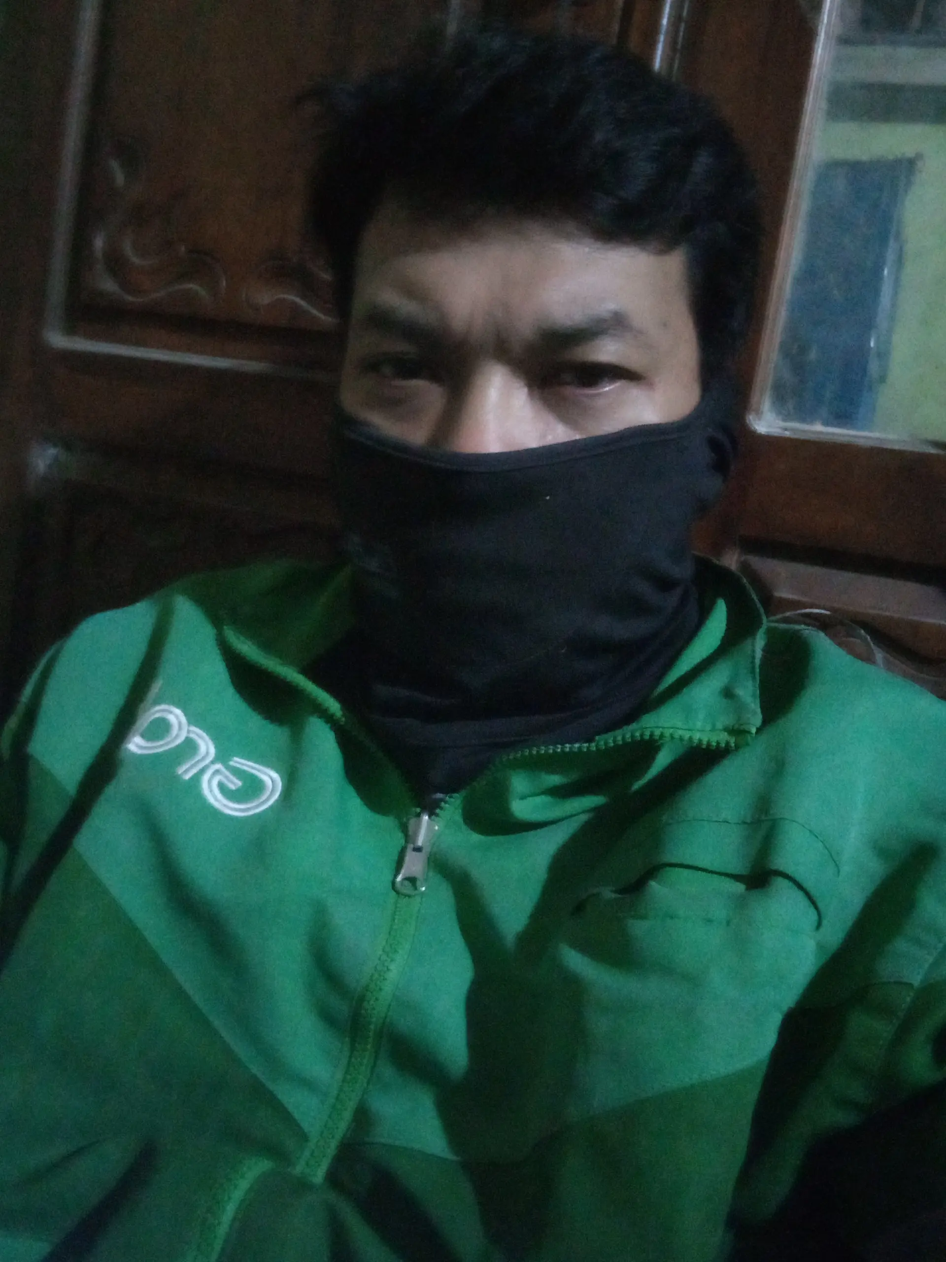 clad in my green ride-hailing uniform