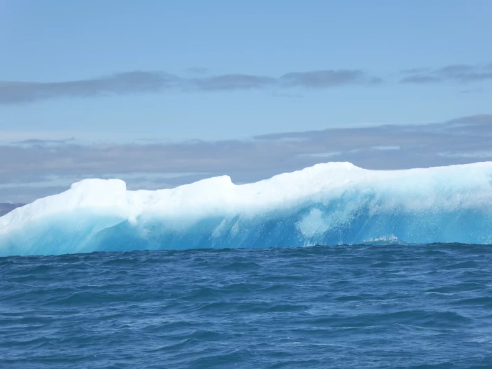 Iceberg tumbling over