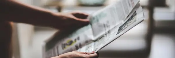 Person Reading Newspaper