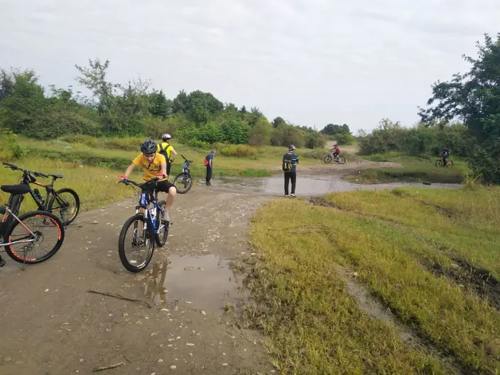 Crossing the Bike Through Water Pits