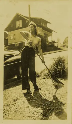 a woman rakes a garden