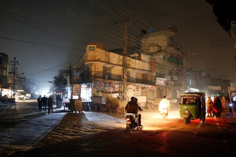 a dark street during widespread power outages in Rawalpindi, Pakistan