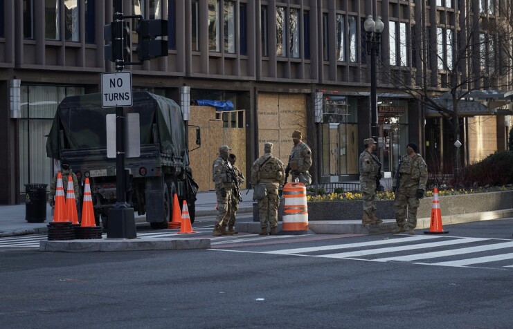 National Guardsmen wondering where they will sleep tonight. Photo by Ian Hutchinson