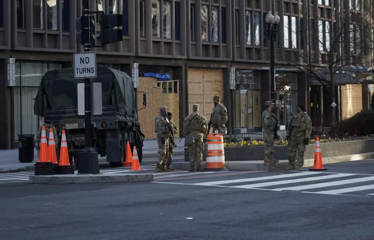 National Guardsmen wondering where they will sleep tonight. Photo by Ian Hutchinson