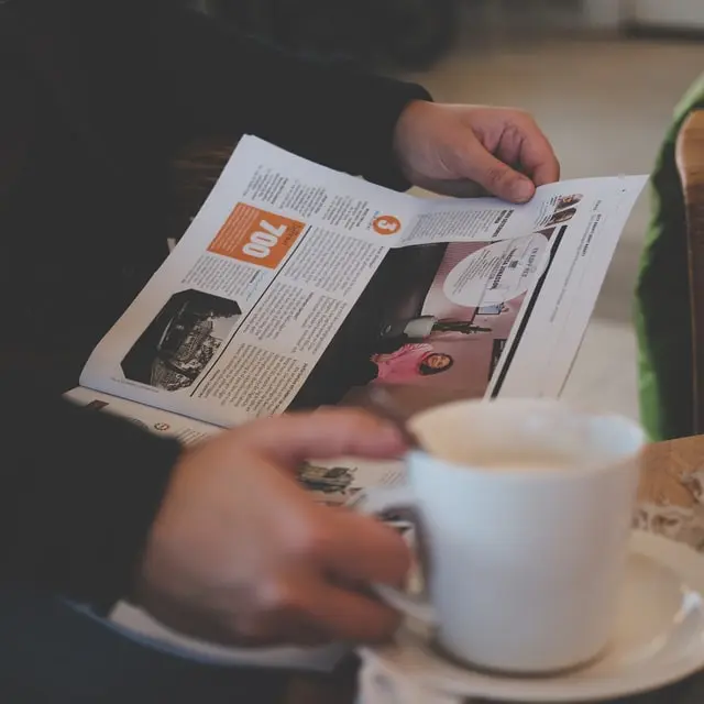 Newspaper with coffee