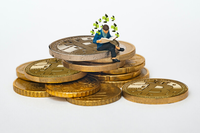 Rich man sitting on pile of BTC