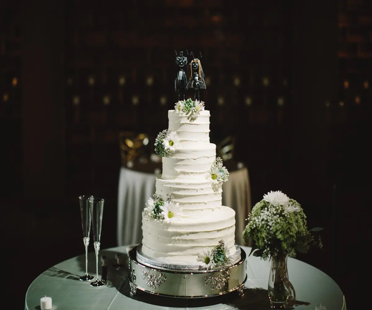 three tier wedding cake with toppers