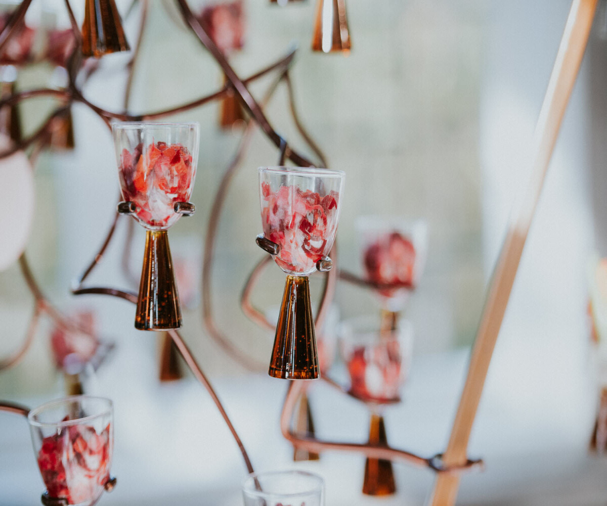 little hors d'oeuvres in glasses like flowers on a tree