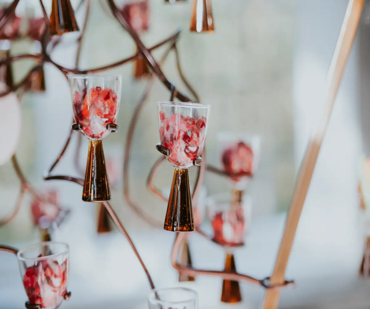 little hors d'oeuvres in glasses like flowers on a tree