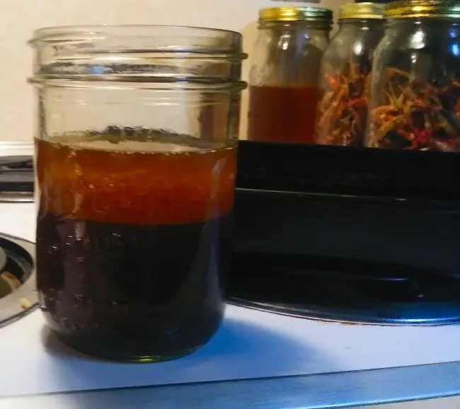 Chicken drippings poured into Mason jar