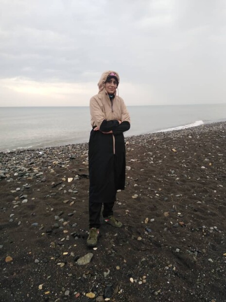 Run at the Beach Under Heavy Rain Next to Restless Waves