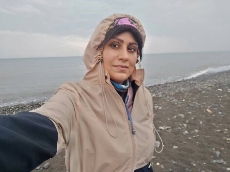Run at the Beach Under Heavy Rain Next to Restless Waves