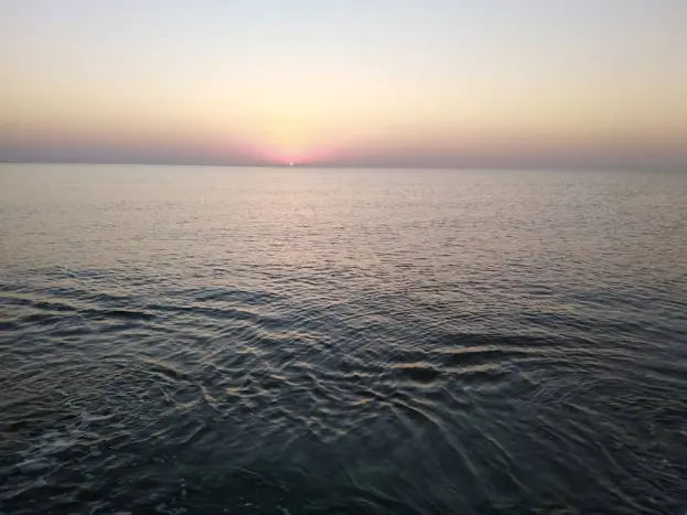 Sunrise, & The Fishing Boat Abandoned among Motionless Waters