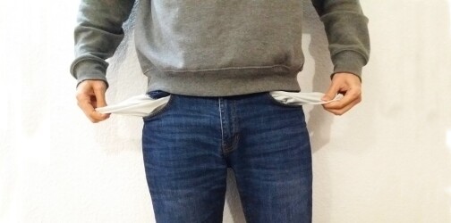 a man emptying his empty pockets