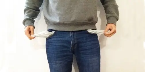 a man emptying his empty pockets