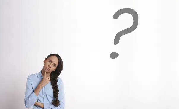 a women thinking beside a question mark
