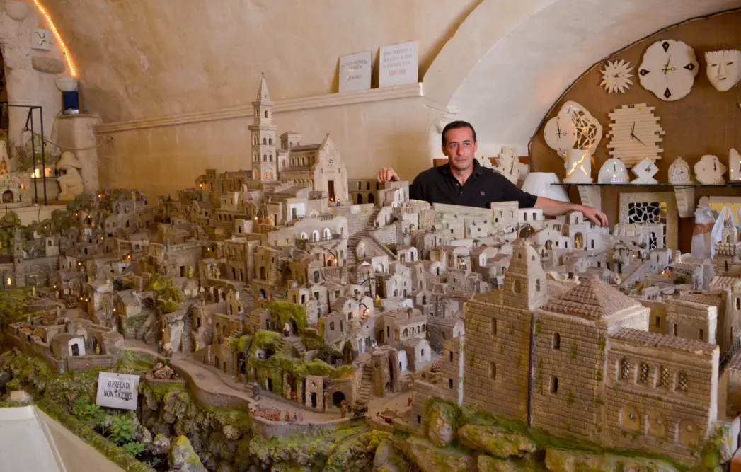 A resident of SASI DI MATERA with his model of the ancient city
