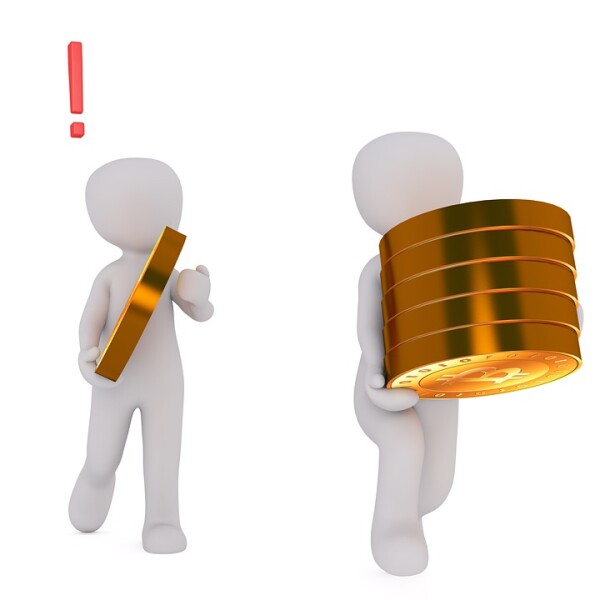 two figures carrying bitcoin coins