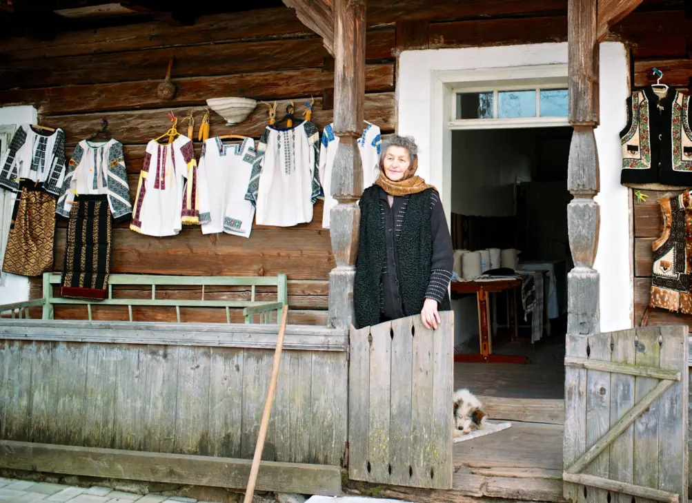 A Romanian lady selling traditional clothes.