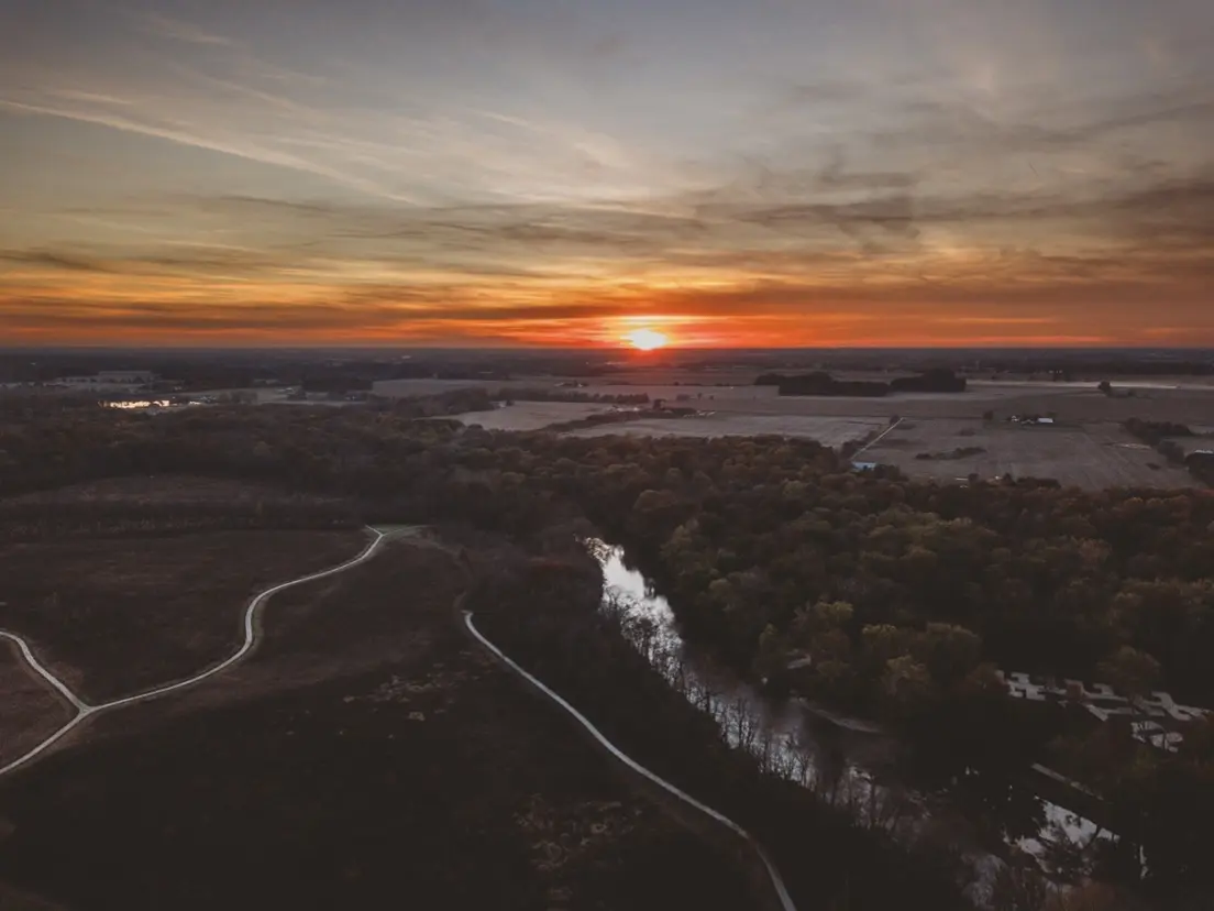 Sunset river and fields in autumn