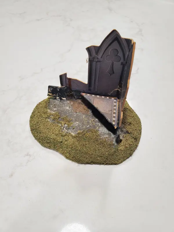 A Gothic cathedral fortification mounted on a base