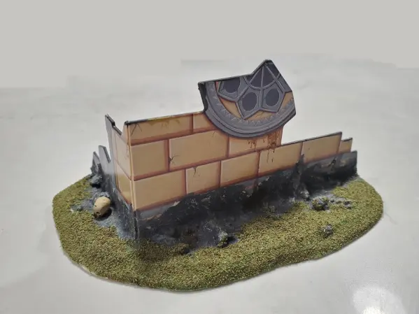 A crumbling Gothic Cathedral fortification with its base (Notice the skull on the left)