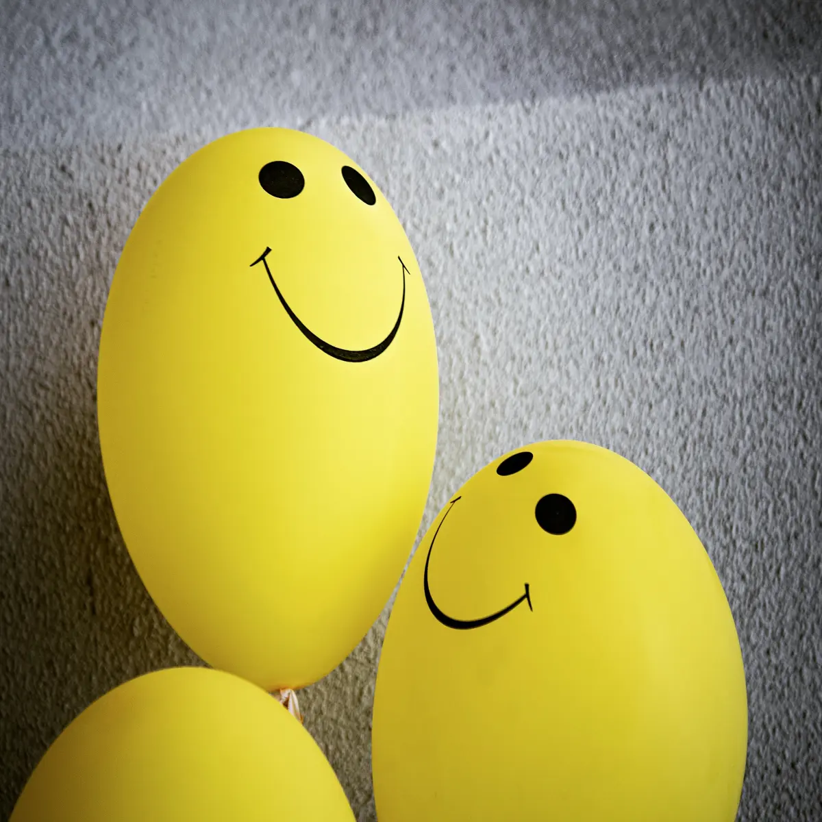 Happy yellow balloons with smily faces