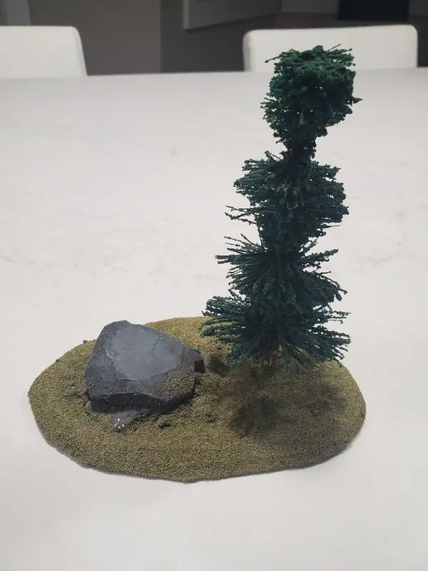 Small tree and a rock on a foam platform