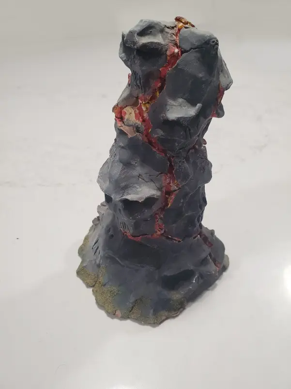 Rock column with lava and skulls