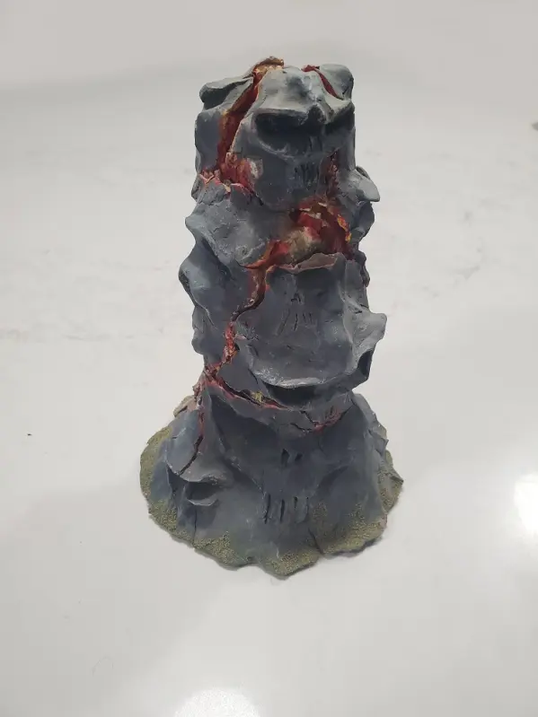 Rock column with lava and skulls