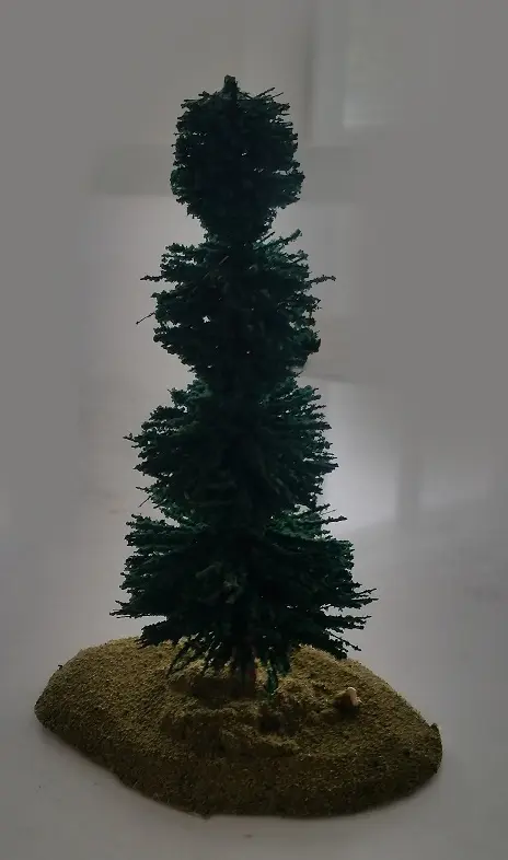 Tree miniature with grass flock on the ground