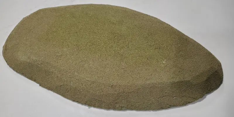 A large hill covered with grass flock for tabletop gaming