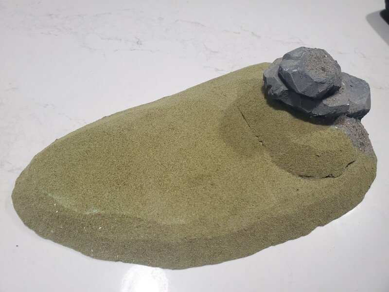 Large Hill with some rocks built on top of it