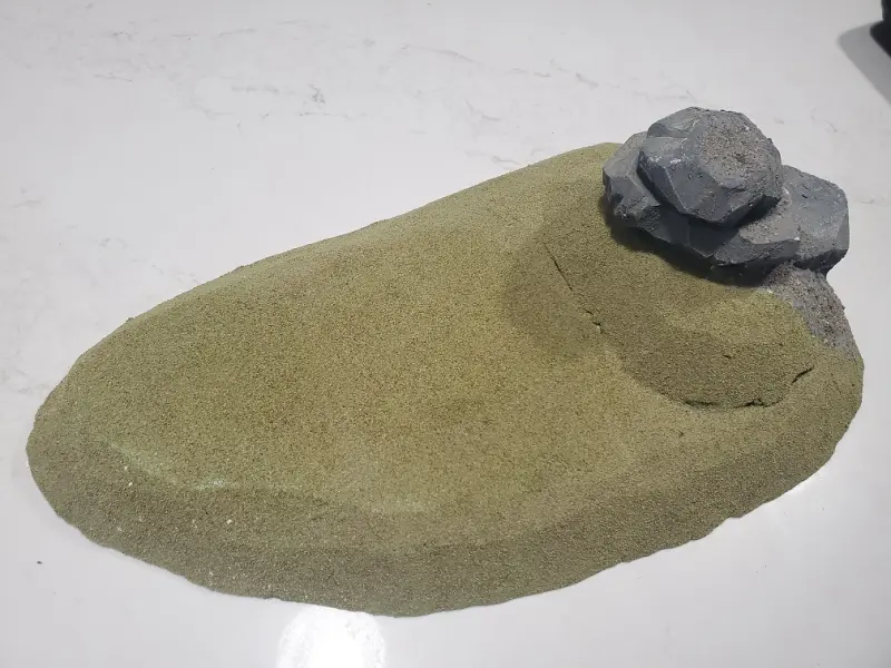 Large Hill with some rocks built on top of it