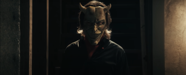 Ethan Hawke as Grabber wearing a mask in The Black Phone movie