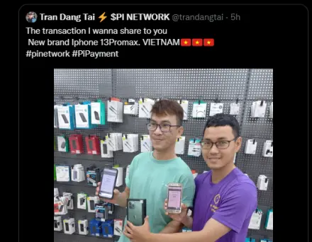 Two persons showing off their new mobile phone purchased with PI