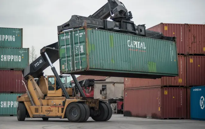 A crane moving a shipping container.