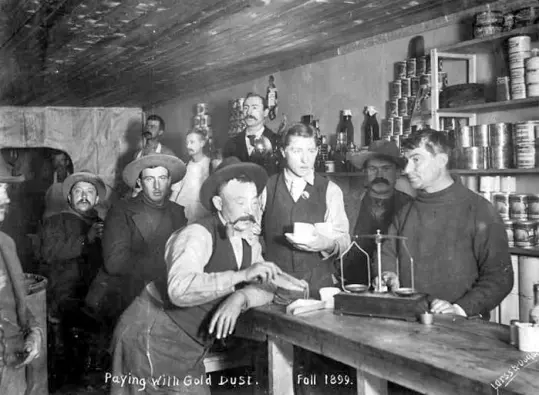 Dawson City during the Klondike Gold Rush. Interior view of grocery store.