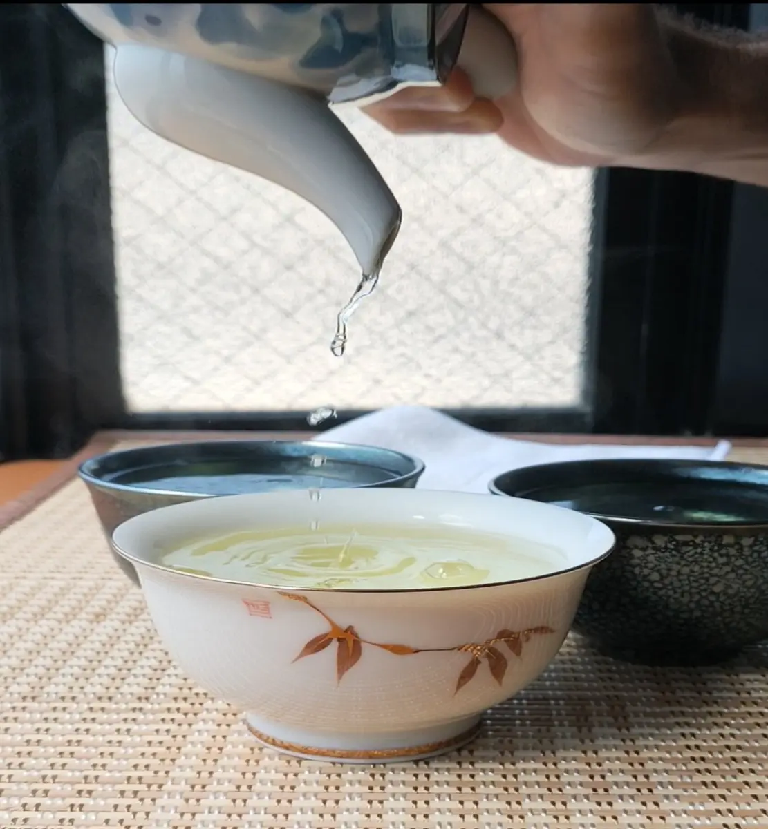 Pouring tea in a cup