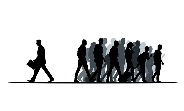 A man walking away from the group.