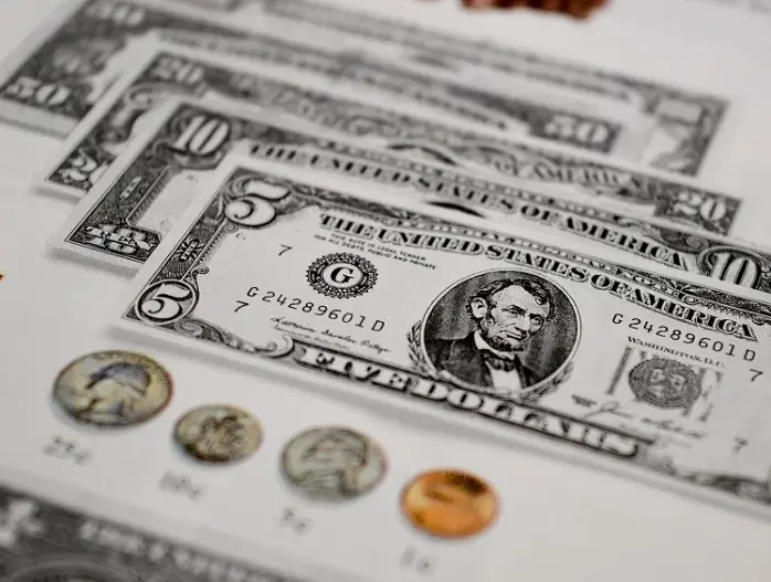 usd dollar bills and coins